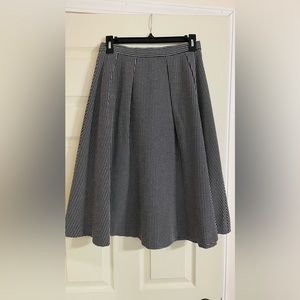 Black and white midi skirt. Flared A-line style. Good material. Mint condition.